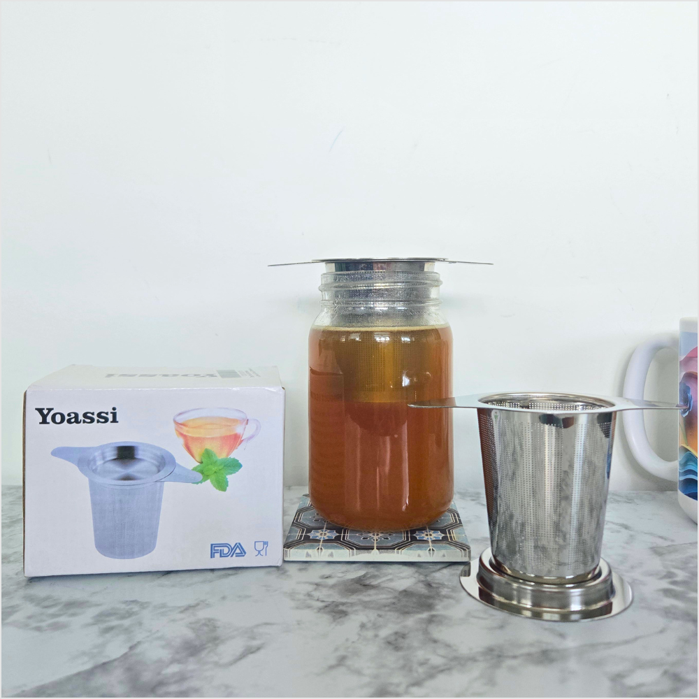Yoassi stainless steel tea infuser strainer with handles for steeping loose leaf tea in mugs, cups, and jars.