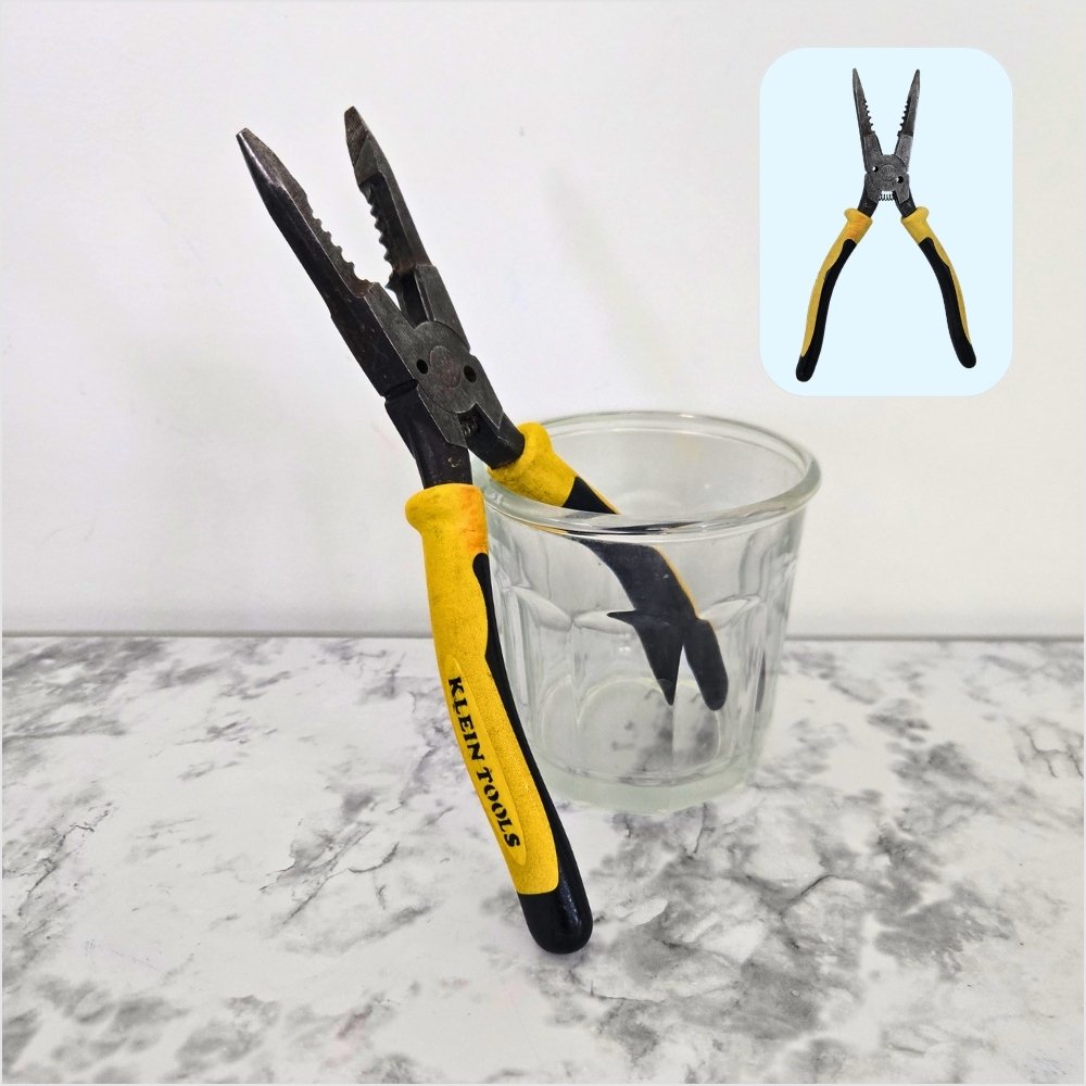 Klein Tools needle-nose pliers with yellow and black handles, standing in a clear glass, a kitchen-only tool for pulling the stems off dried shiitake mushrooms.